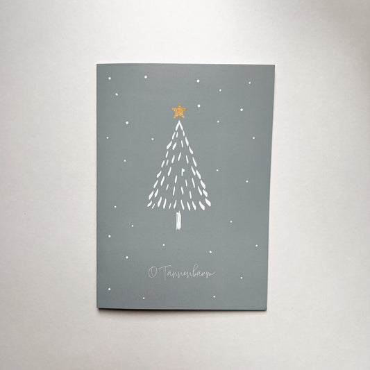 Minimalistische Weihnachtskarte mit Tannenbaum-Motiv auf grauem Hintergrund und gelbem Stern an der Spitze.