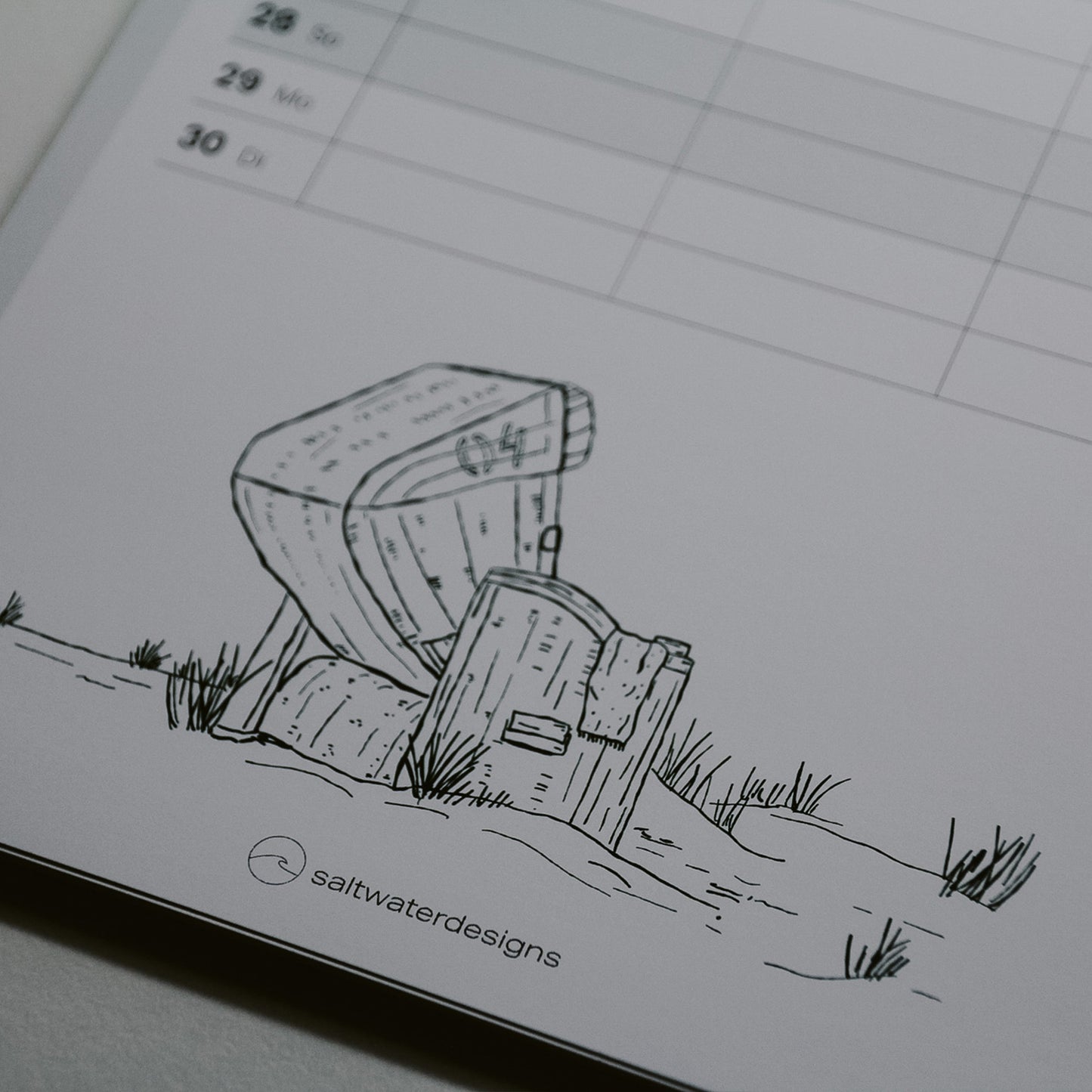 Detail Aufnahme vom Kalender 2026 von der Illustration Strandkorb in den Dünen.